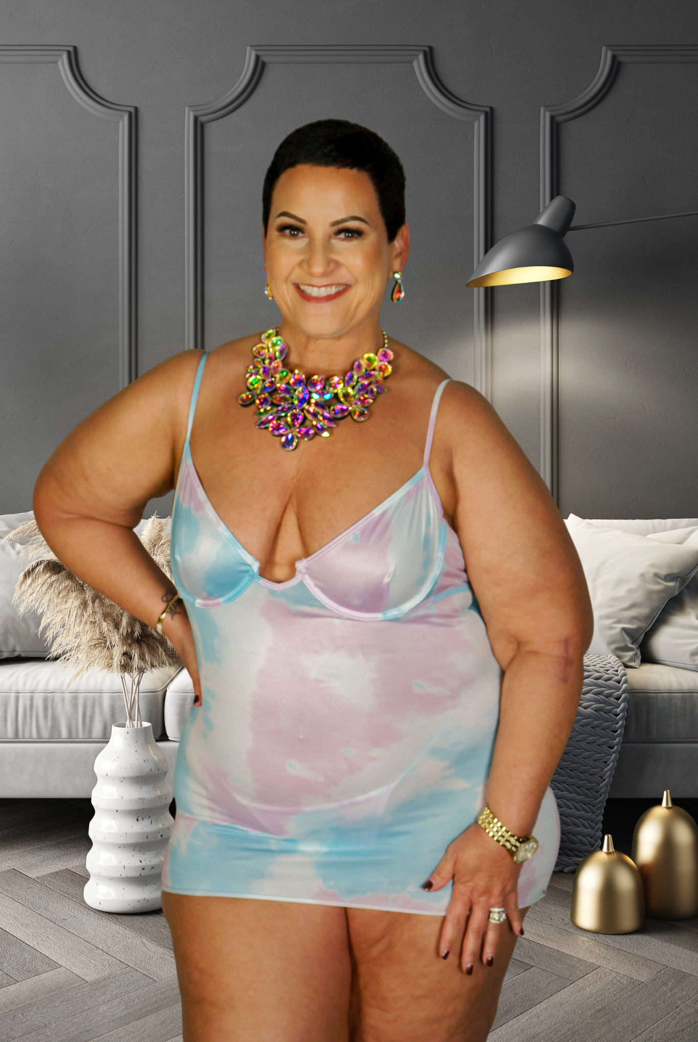 Plus size woman wearing a pastel tie-dye unicorn babydoll dress with thin straps and deep neckline