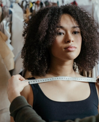 Woman being measured with a tape for bra size illustrating steps to measure bra size easily