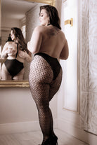 CT Lingerie plus size bodystocking black geometric fishnet with open back on model plus size lingerie harness