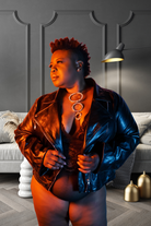 Plus size red lace bodysuit worn with black leather jacket and statement necklace by CT Lingerie clearance
