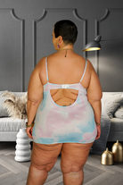 Plus size model wearing a pastel unicorn babydoll dress with open back detail from CT Lingerie