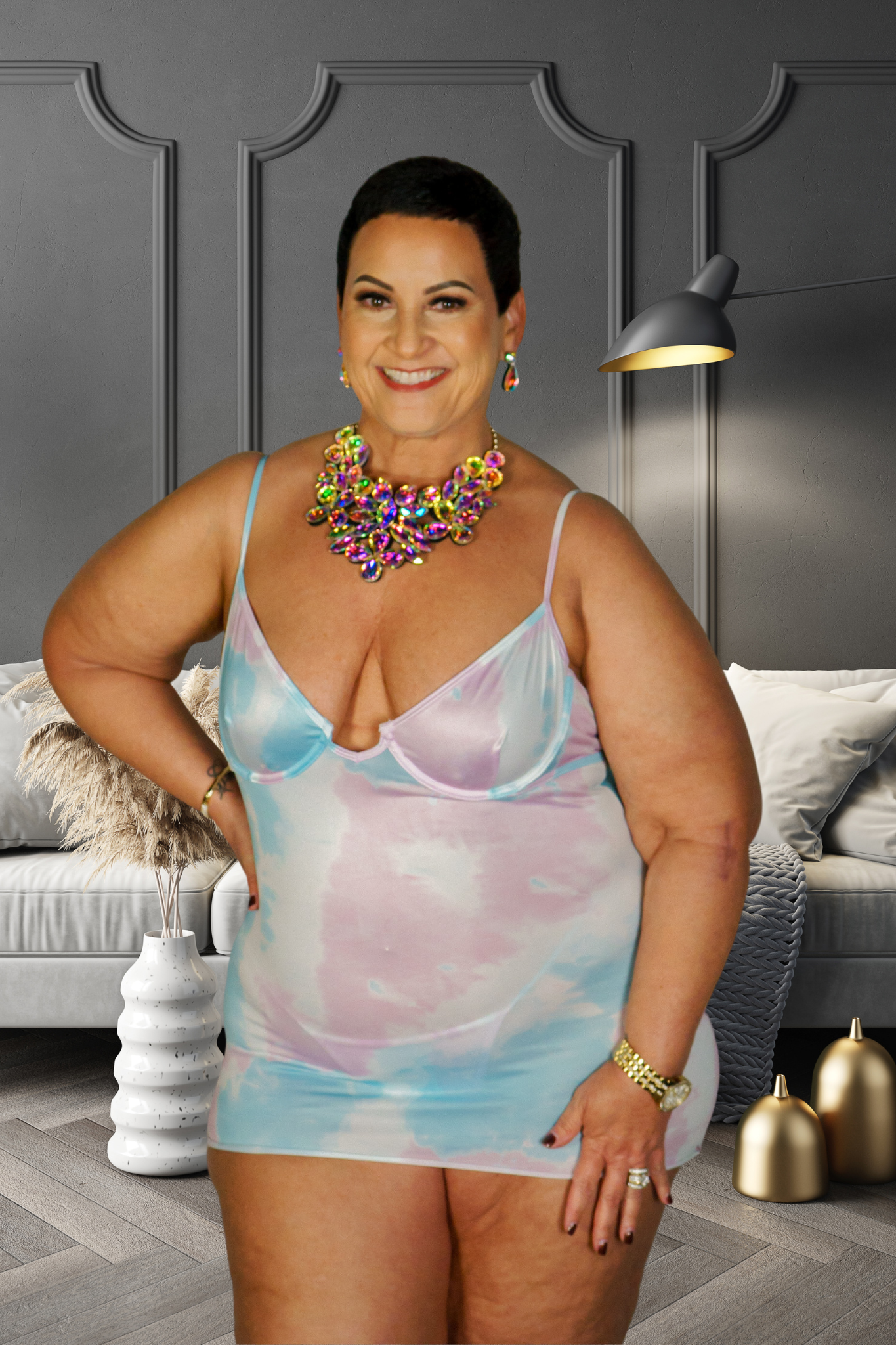 Plus size woman wearing a pastel tie-dye unicorn babydoll dress with thin straps and deep neckline