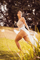 versatile plus size bodysuit lingerie sheer teddy with flowing fabric outdoors